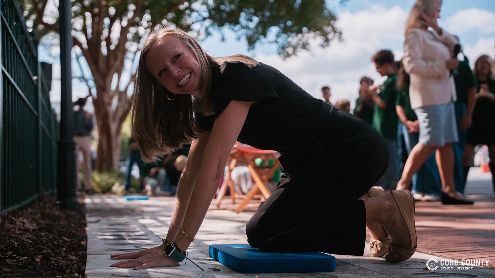 Amanda Dillard pressing hands into her handprints