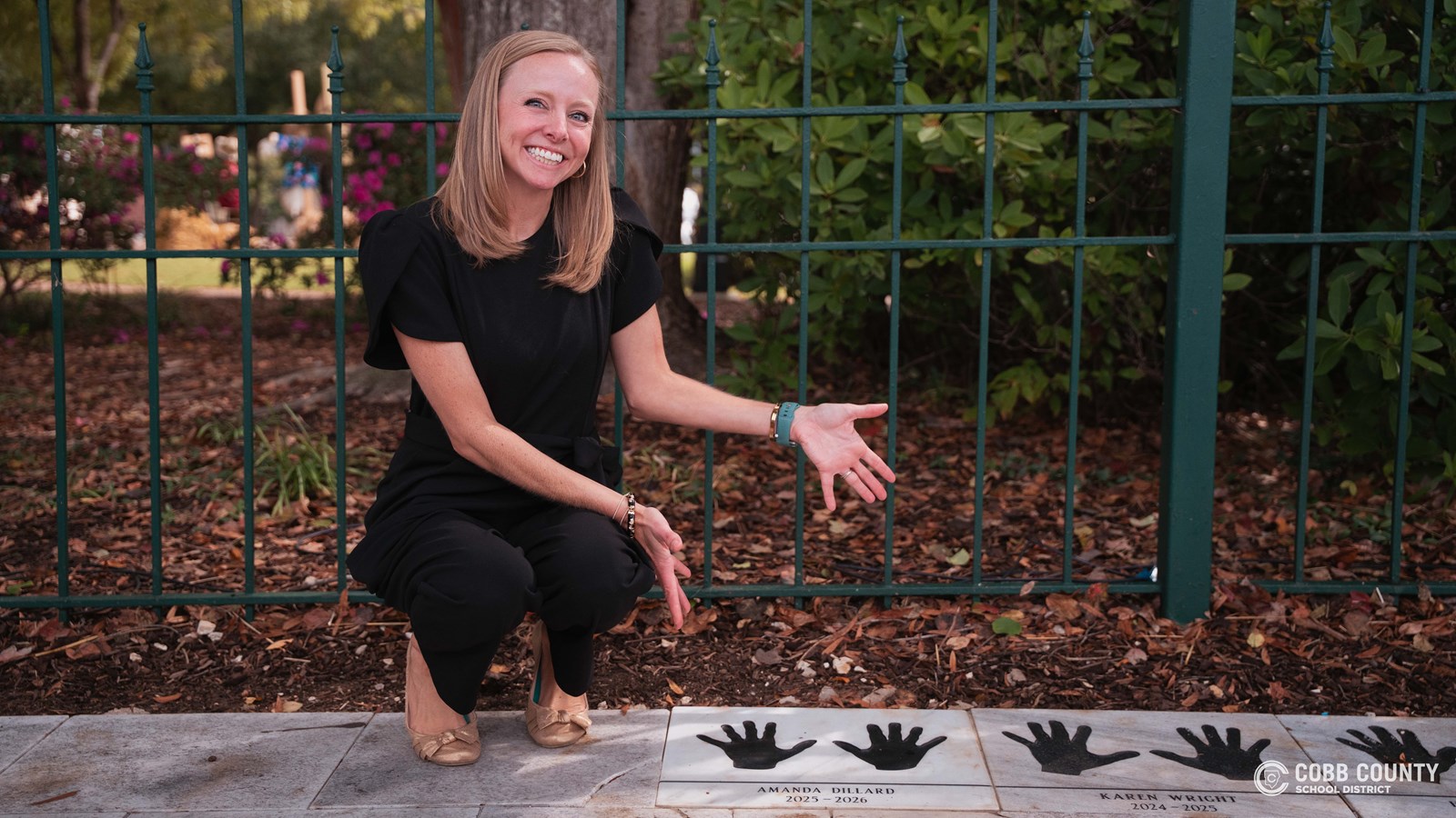 Teacher of the Year Amanda Dillard unveiling her handprints