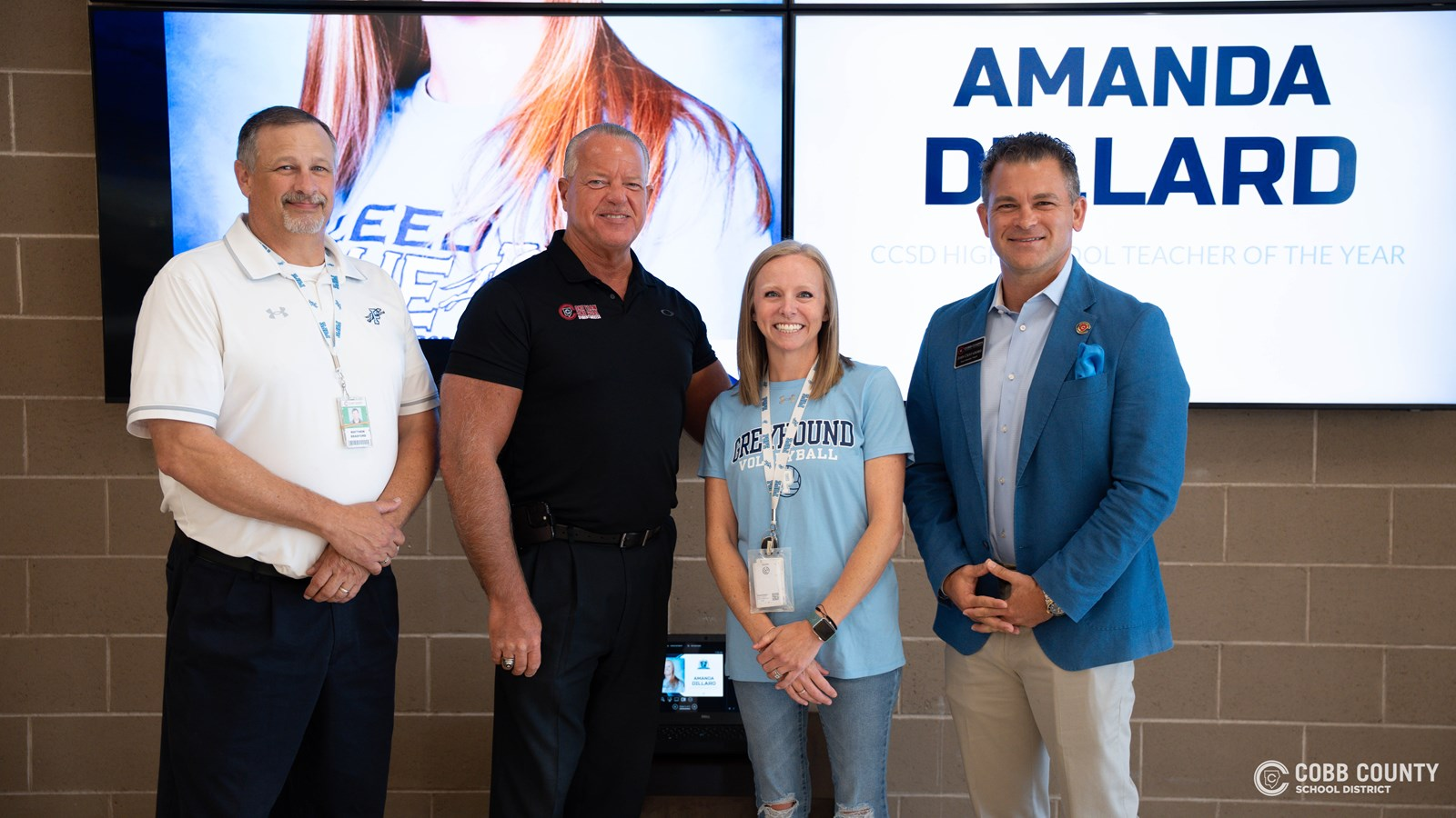 Cobb Schools Board Member John Cristadoro celebrates Pope High School’s Amanda Dillard, the 2025 High School Level Teacher of the Year, honoring her dedication to inspiring students and excellence in the classroom.