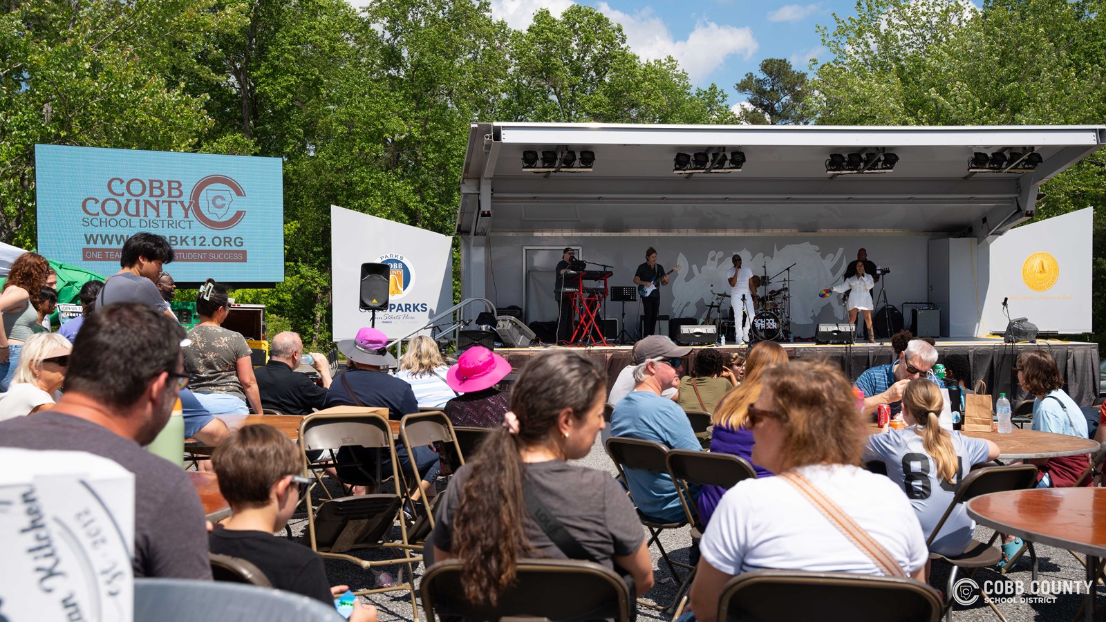 Families, friends, and community members filled the area with energy and encouragement for every student performance.