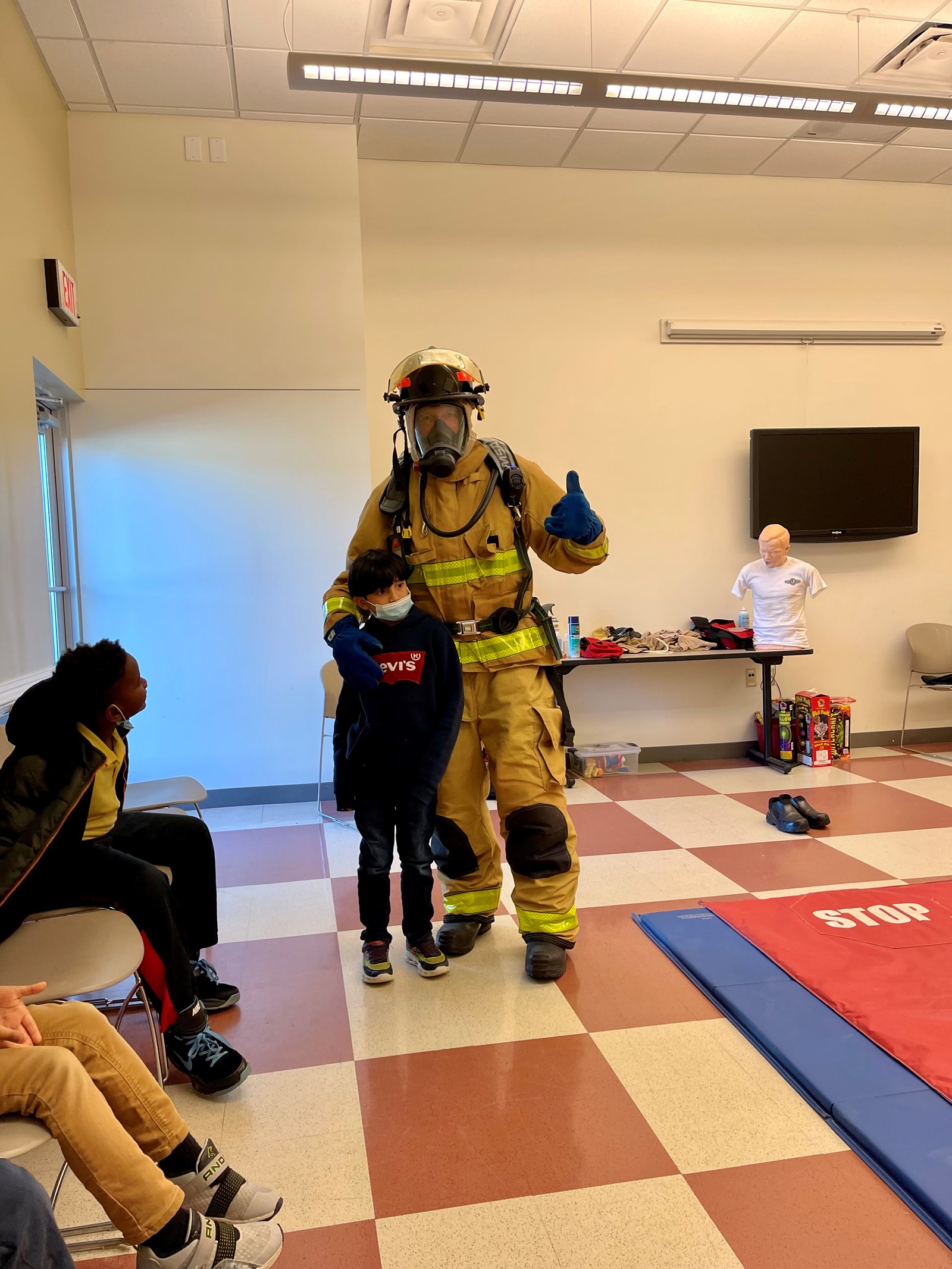 student with fire fighter
