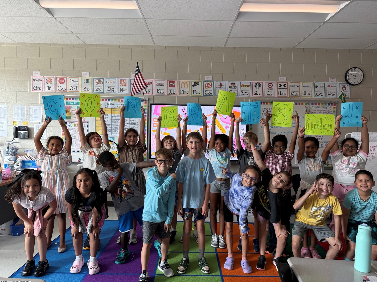 “Eastvalley Elementary classmates cheer on Finley like a hometown hero after his regional victory.”
