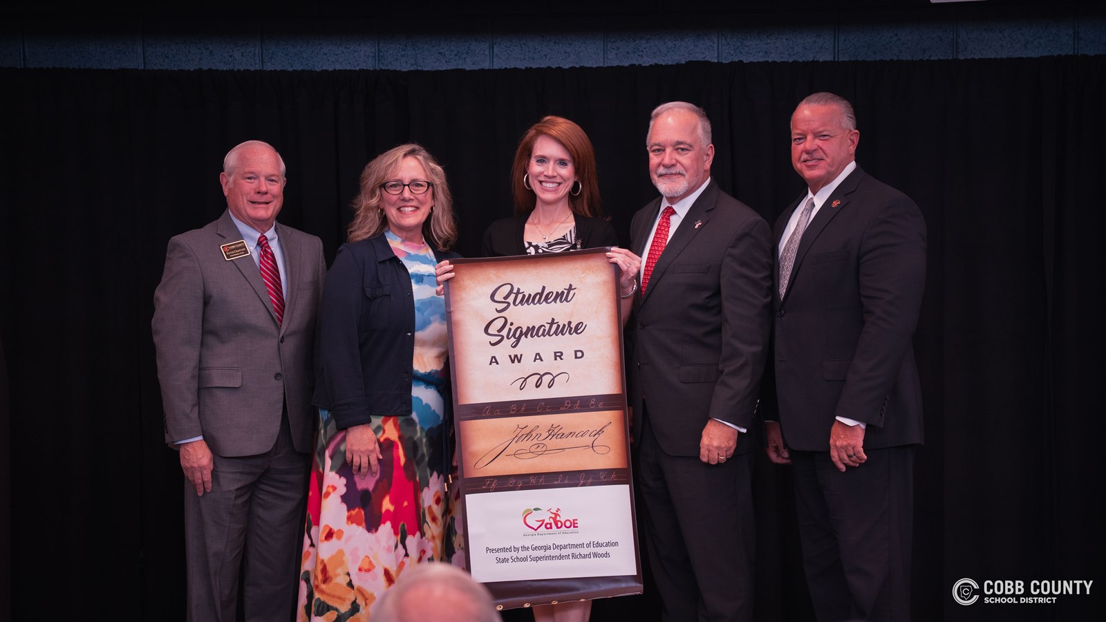 GADOE and Superintendent Richard Woods awards Garrison Mill Elementary School the John Hancock Award.