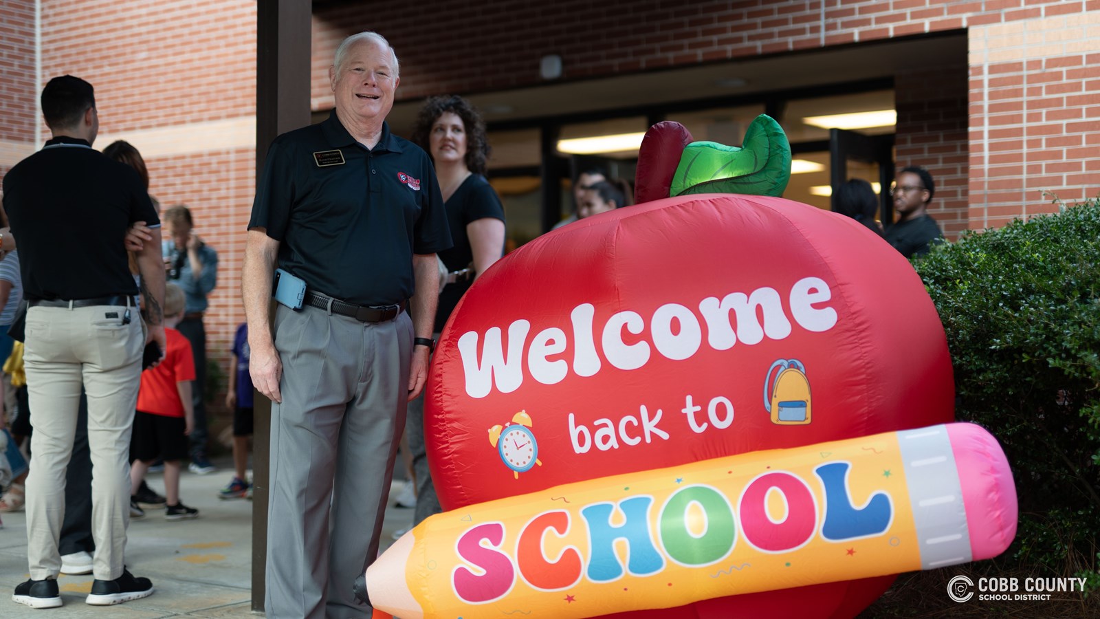 Cobb Schools Board Chair David Chastain welcomes families at Chalker Elementary School.