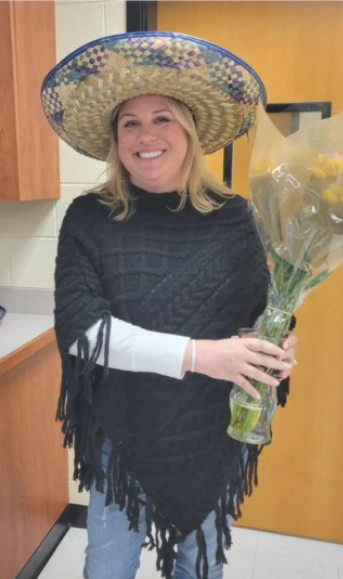 Meredith%20Donnelly%20with%20flowers%20smiling.PNG