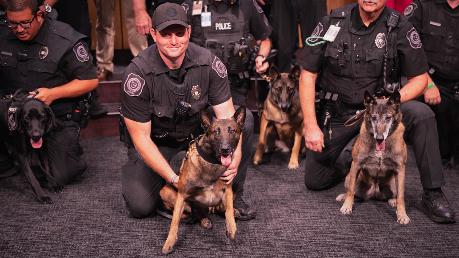 Cobb Schools police officers and Vapor Wake dogs attend the board meeting.
