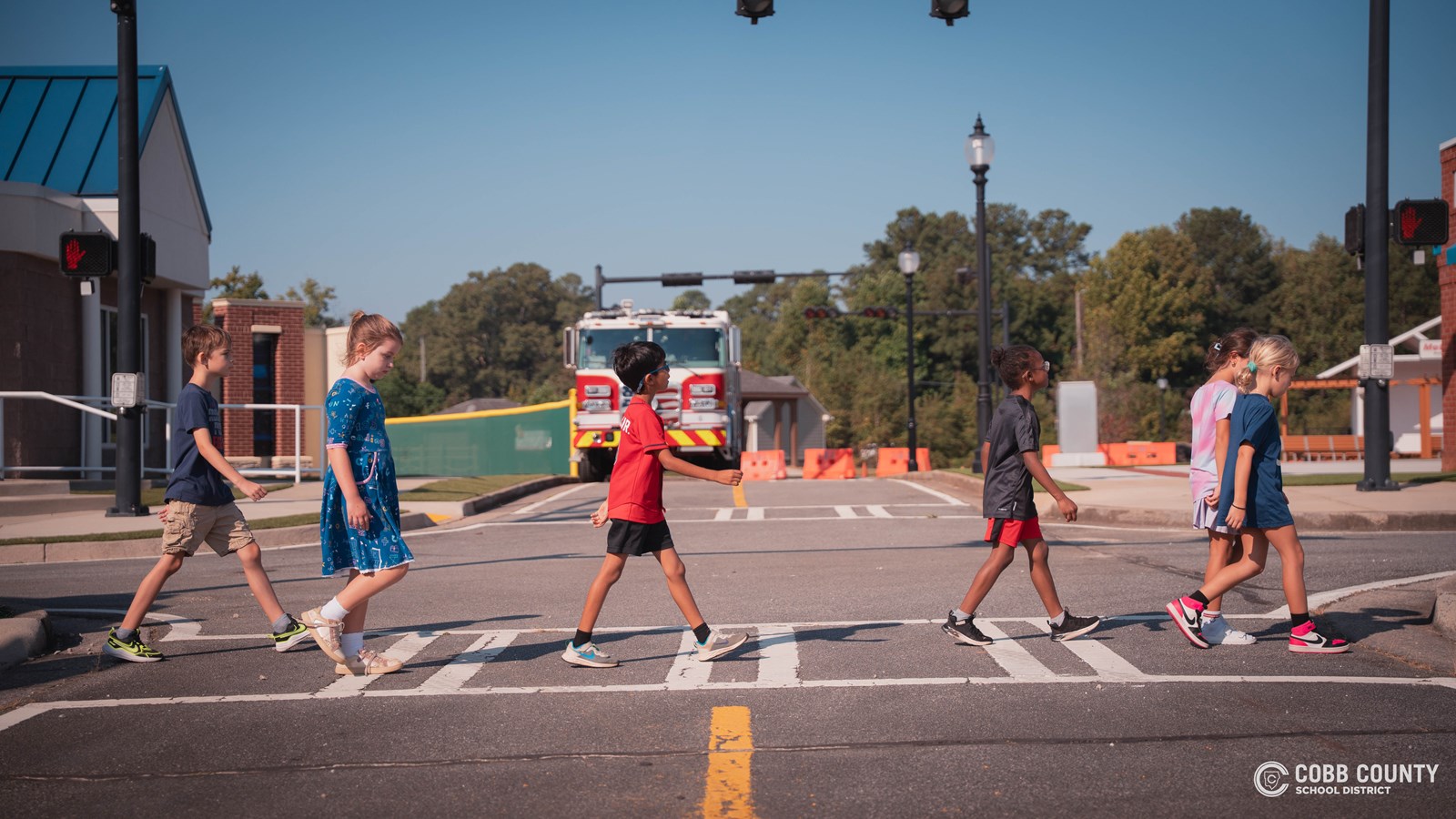 Students walking across crosswalk 