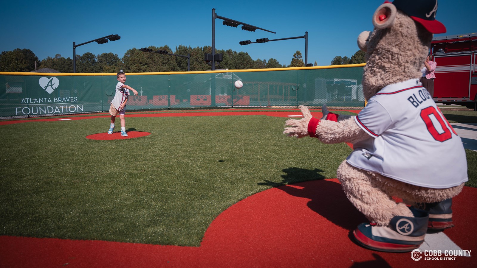 Rocky Mount second grader throwing out first pitch to Blooper