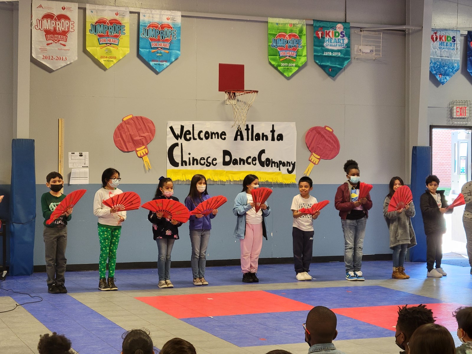 Students using Chinese fans