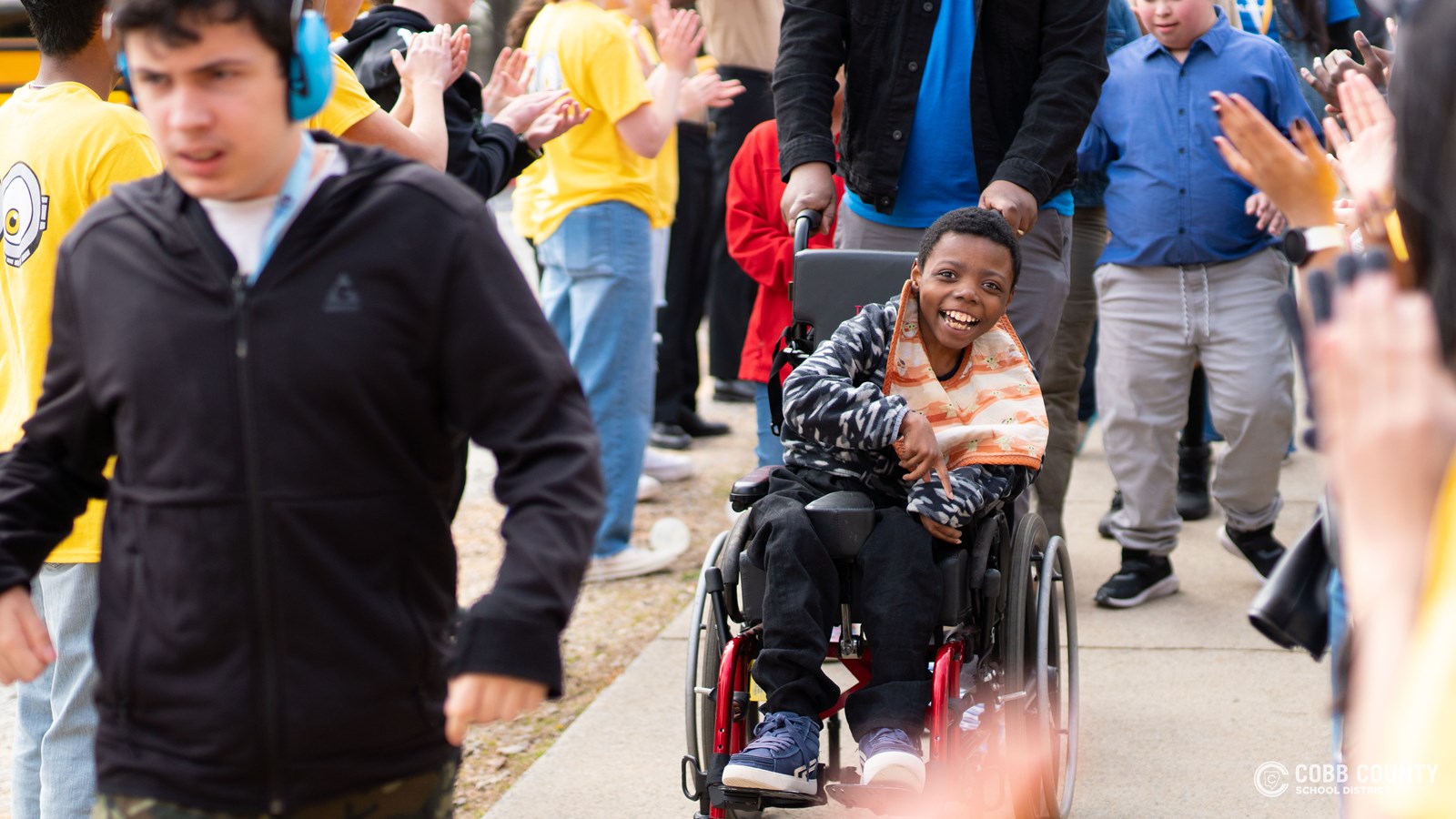 Kennesaw Mountain student volunteers greet their special guests with big smiles and open arms, making sure everyone feels like a VIP at the much-anticipated Dance of the Year!