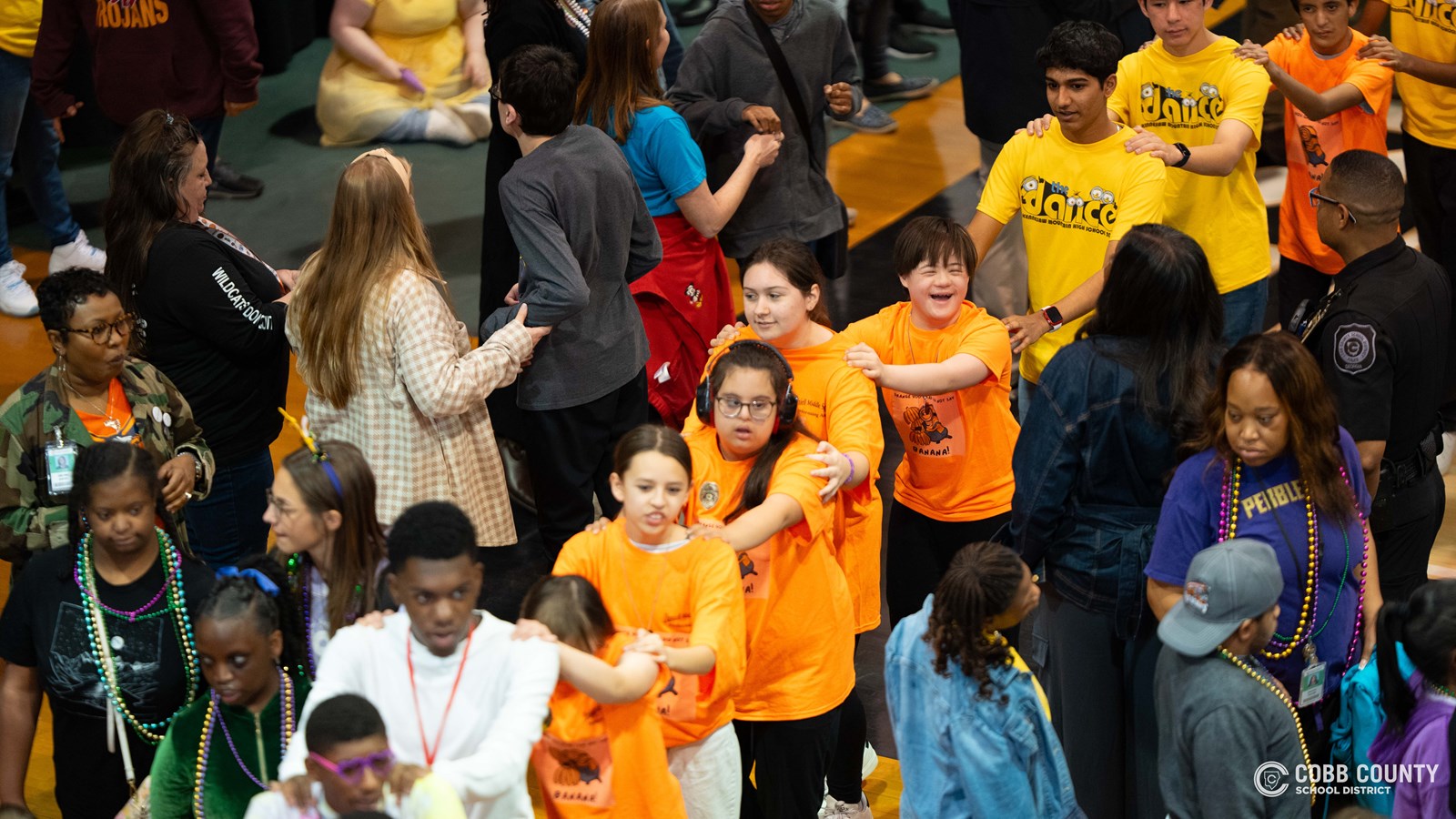 Special student guests from across Cobb County and Kennesaw Mountain High School student volunteers fill the gym with energy, laughter, and non-stop moves at the much-anticipated Dance of the Year!