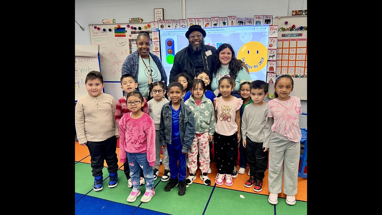 Cobb Schools Board Member Leroy Tre' Hutchins shares the joy of reading with students during a Read Across Cobb event, inspiring young learners to explore new stories and ideas.