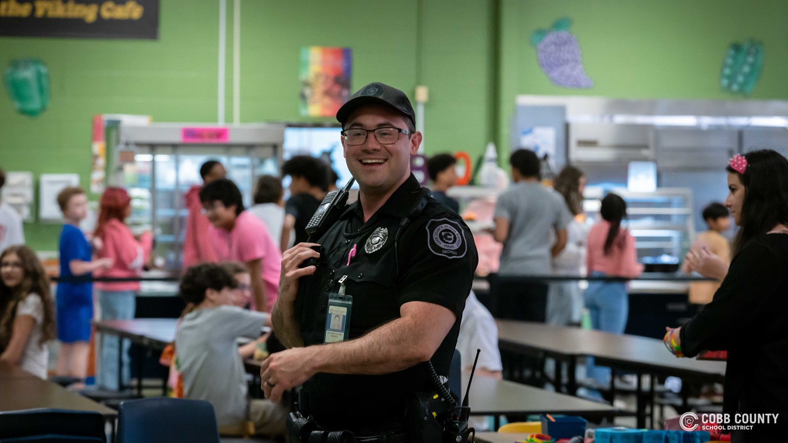 Officer Hurley in cafeteria 