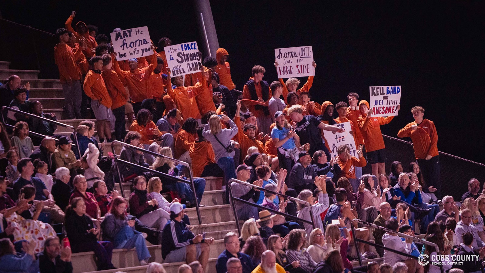 The Kell football team is loud and proud of their school's marching band