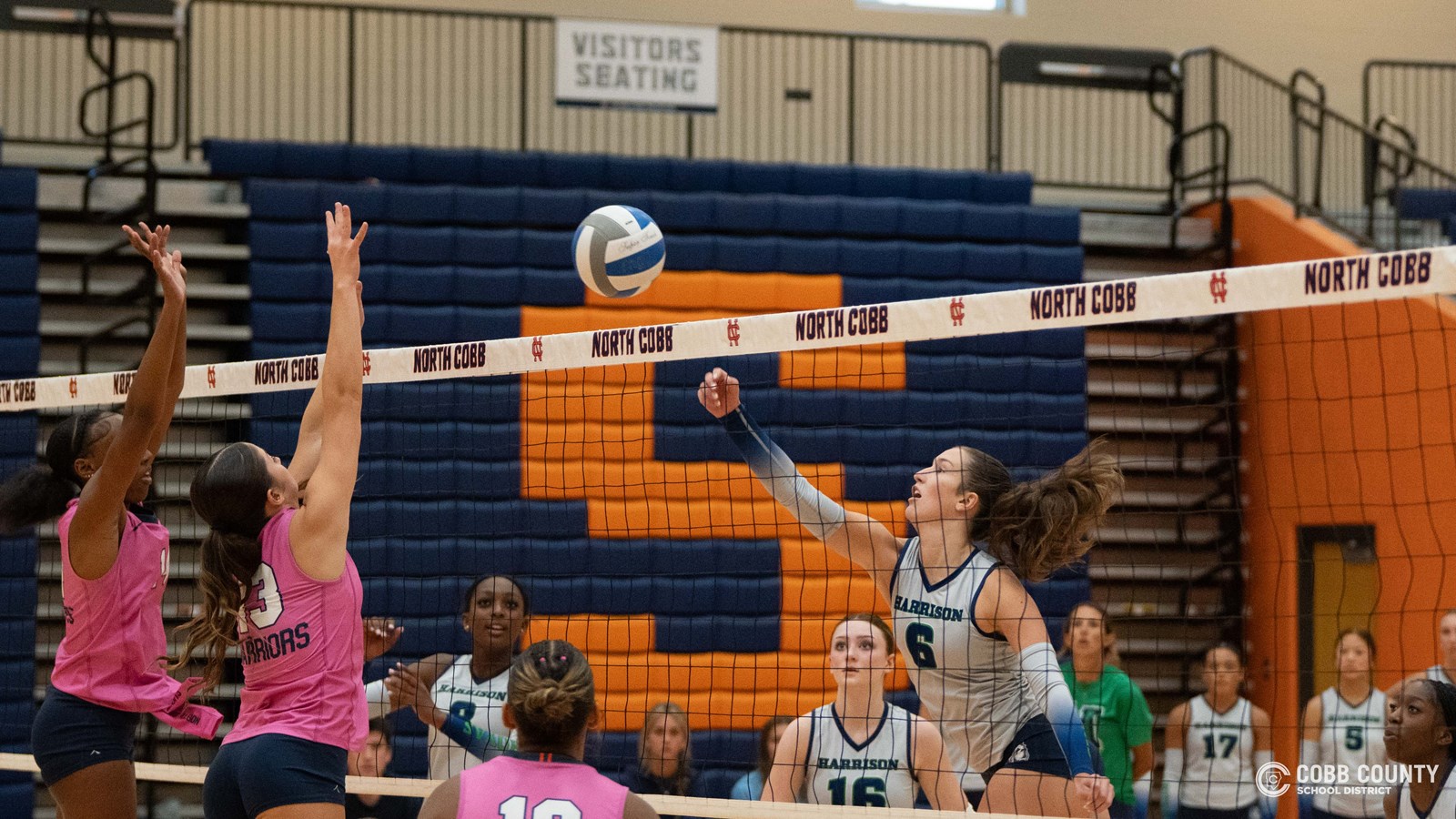 Hoya Jessica Chambers tries to dink the ball over NCHS blockers