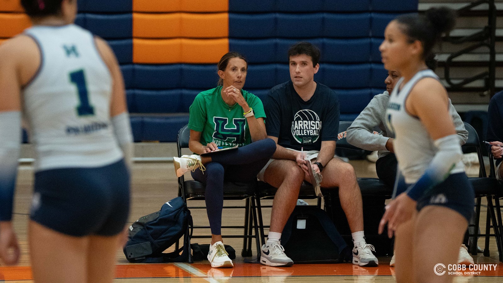 Coach Johnson discusses strategy during a match