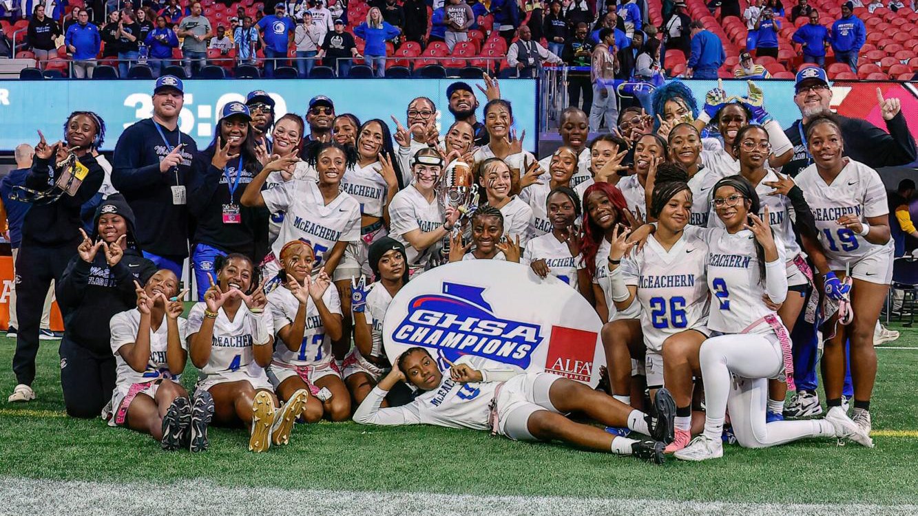McEachern Flag Football team pose for pictures after winning 2024 state title