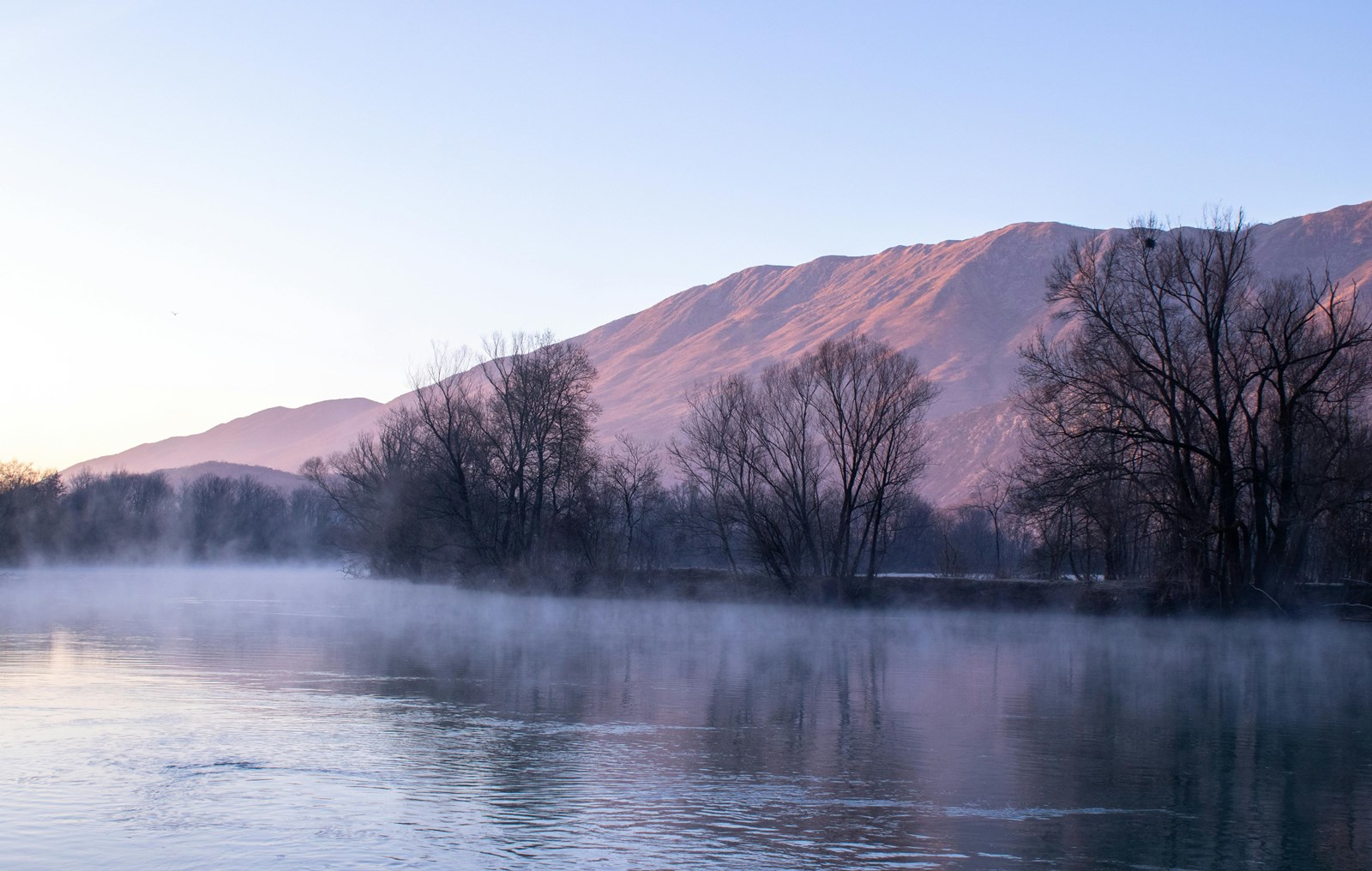 river at the foot of a mountain