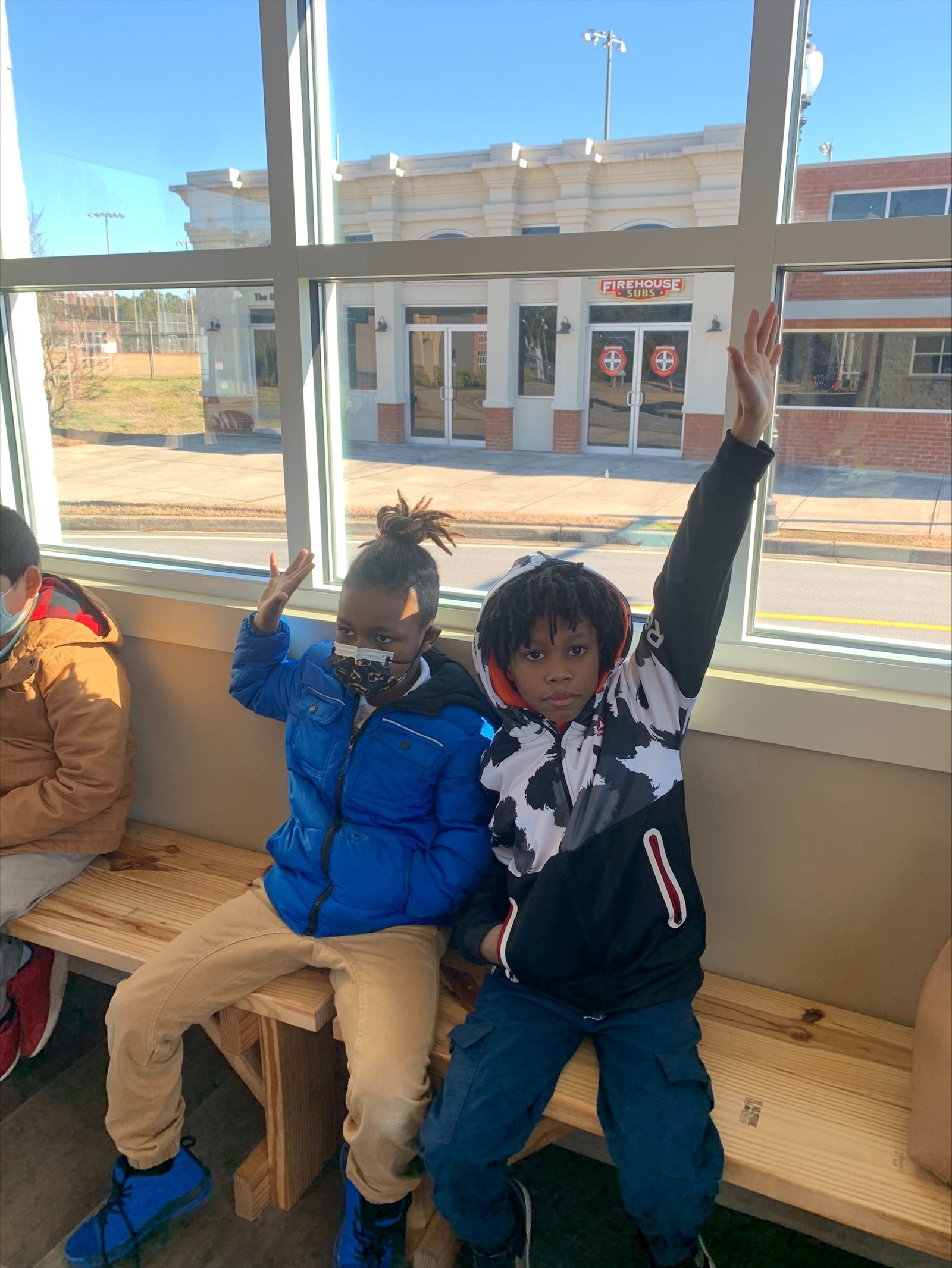 boys sitting on a bench
