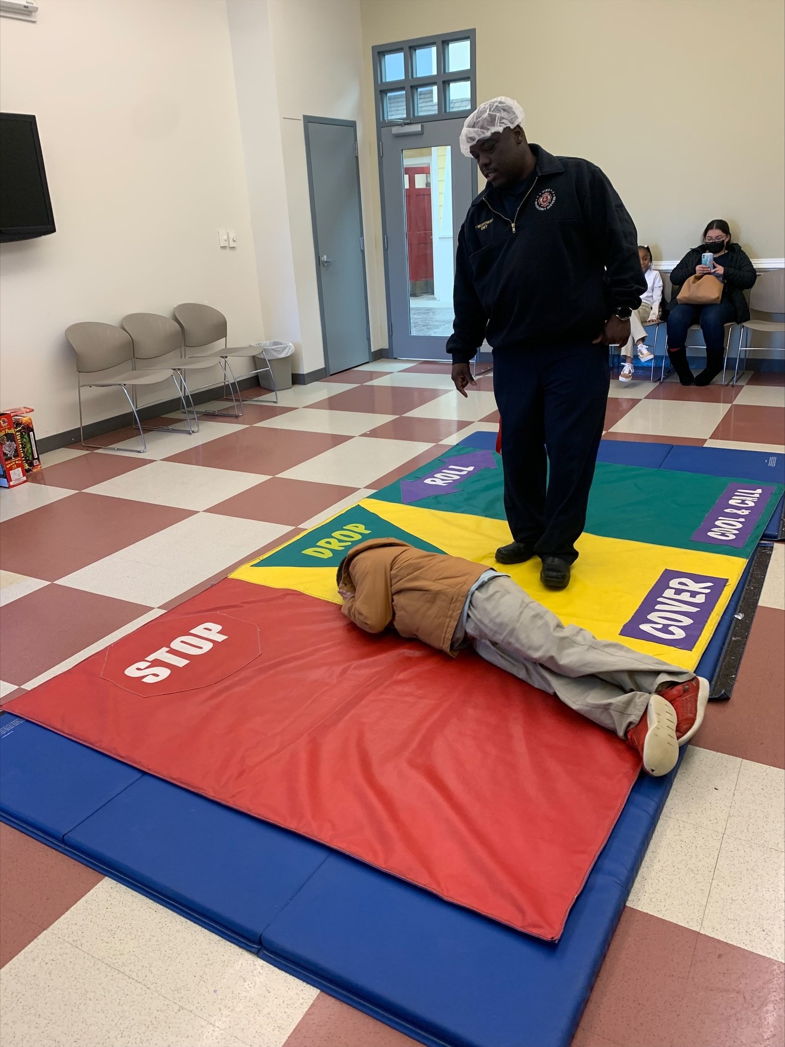 boy practicing stop drop and roll