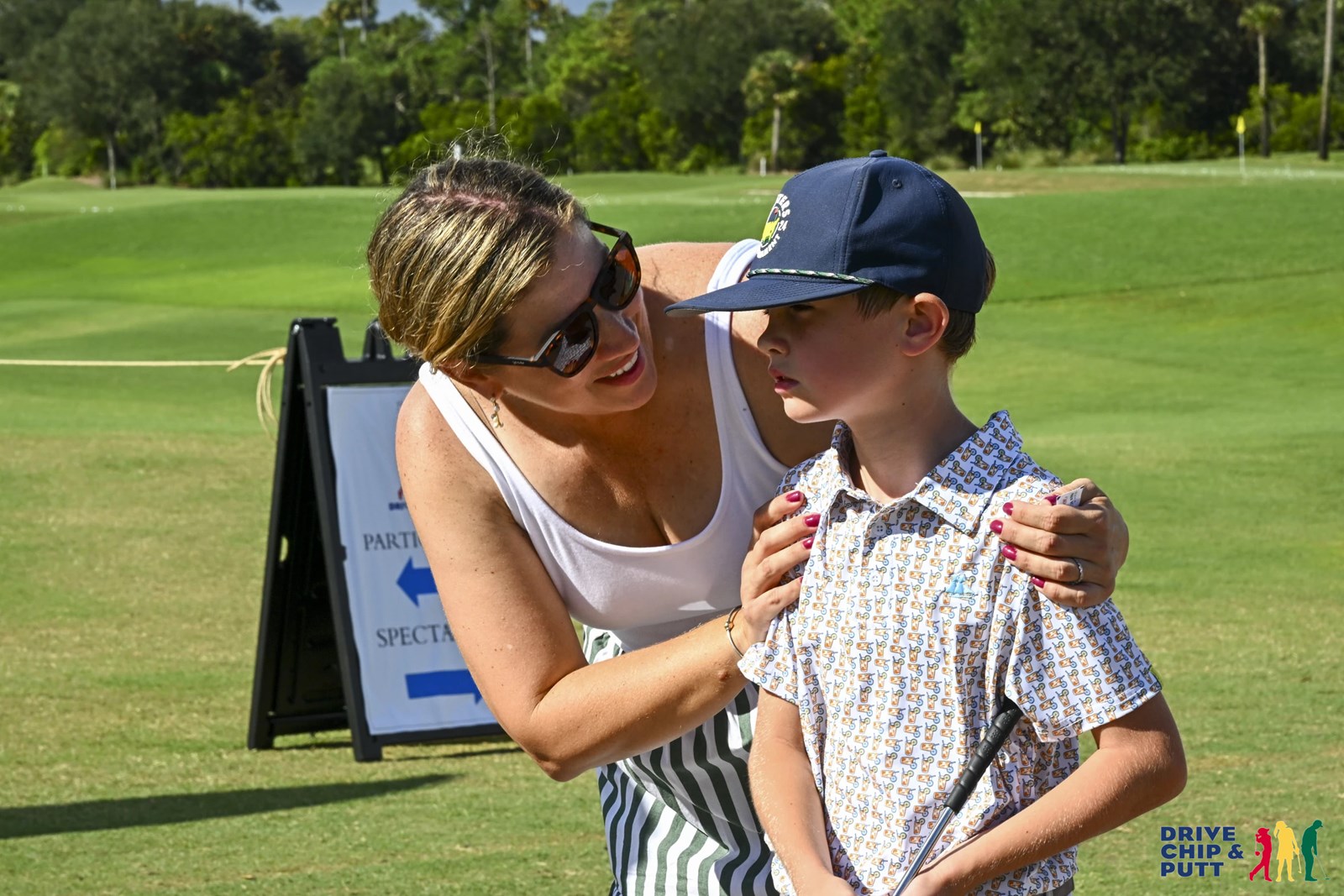 Finley Nelson celebrates his big win with his mom who cheered him through every shot of the TPC Sawgrass competition.