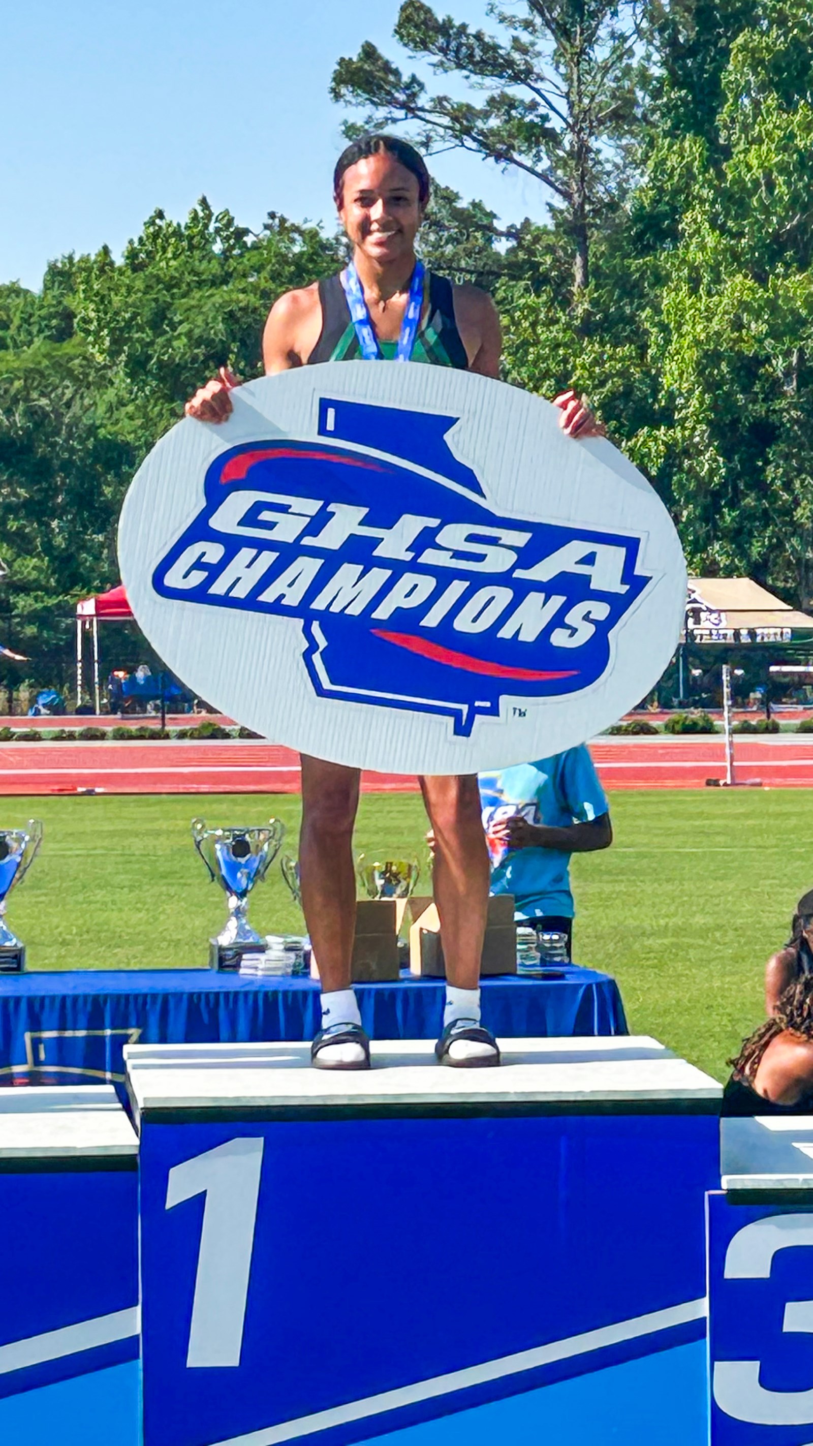 Kennesaw Mountain juninor Ava Okeke atop the podium