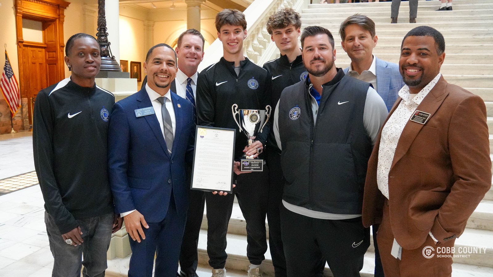 Campbell Soccer team captains, Head Coach Connolly, AD Howard pose with Smyrna Mayor Norton and Senator Howard