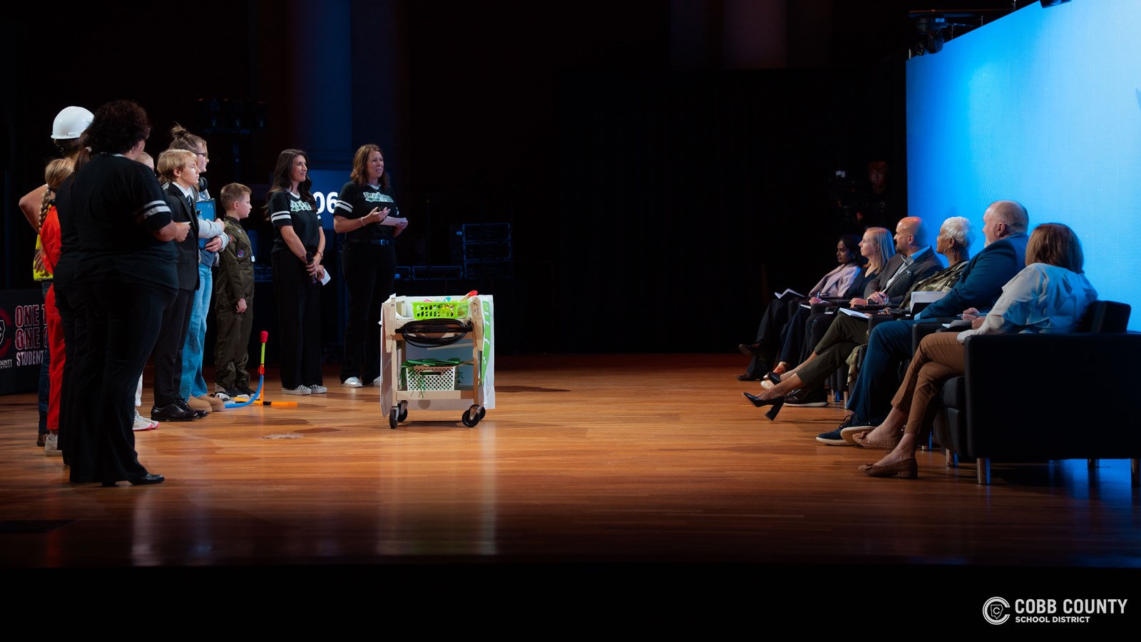 Student and staff presenting to "sharks" at Cobb Tank 2025