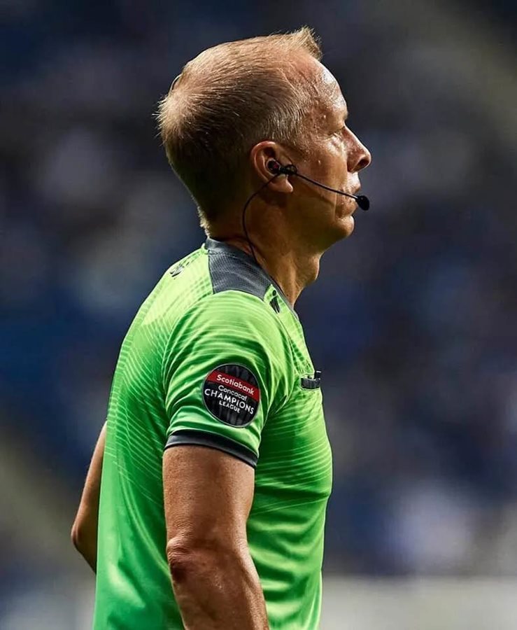 Closeup of Corey Rockwell watching the action as an Assistant Referee