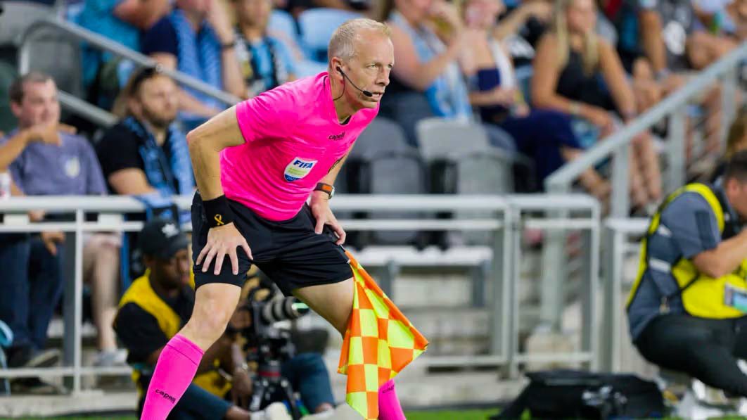 Corey Rockwell watches for offsides as an Assistant Referee during a FIFA game