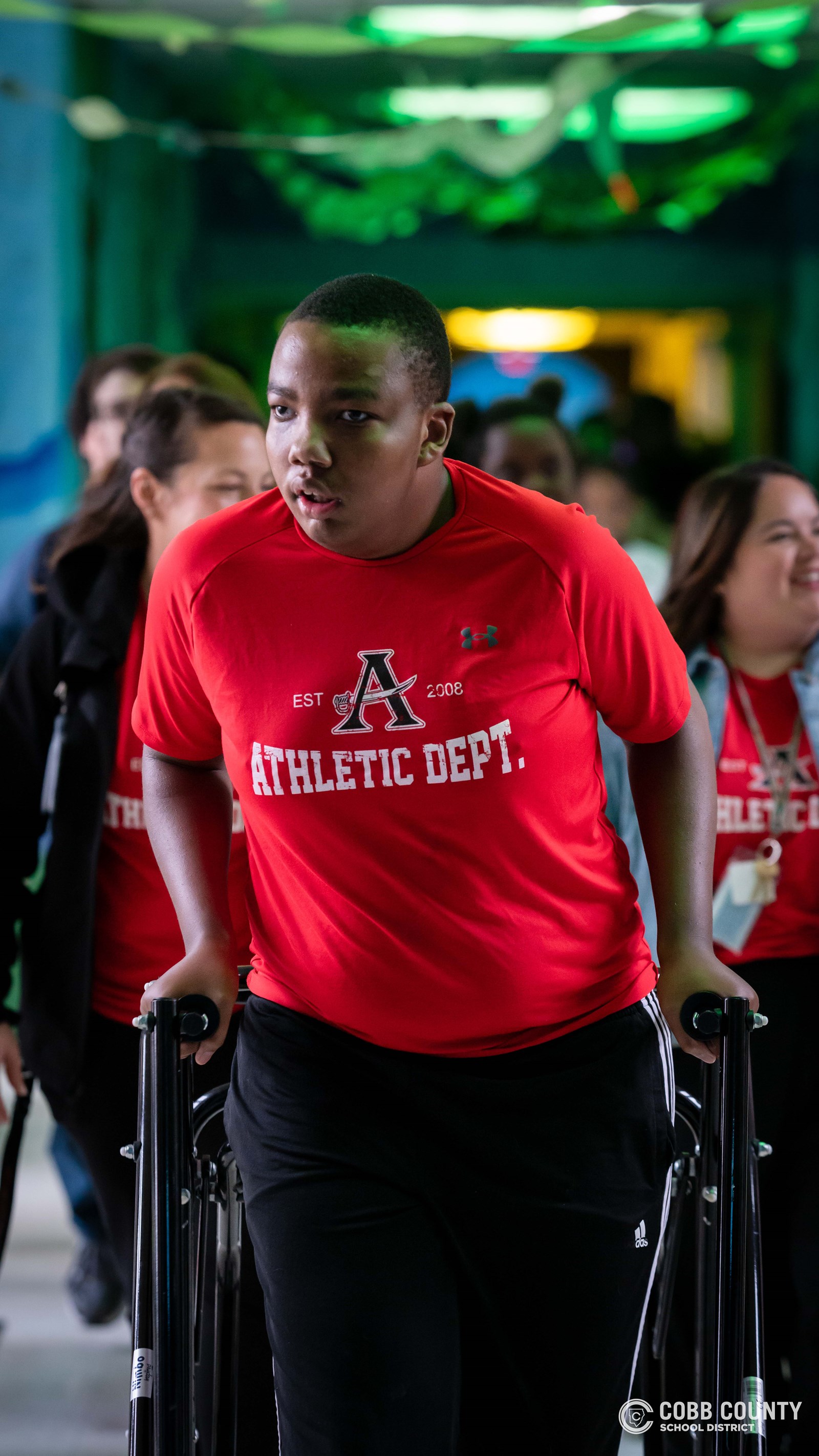 Students and volunteers dancing together at the Cobb Schools Special Education Dance.