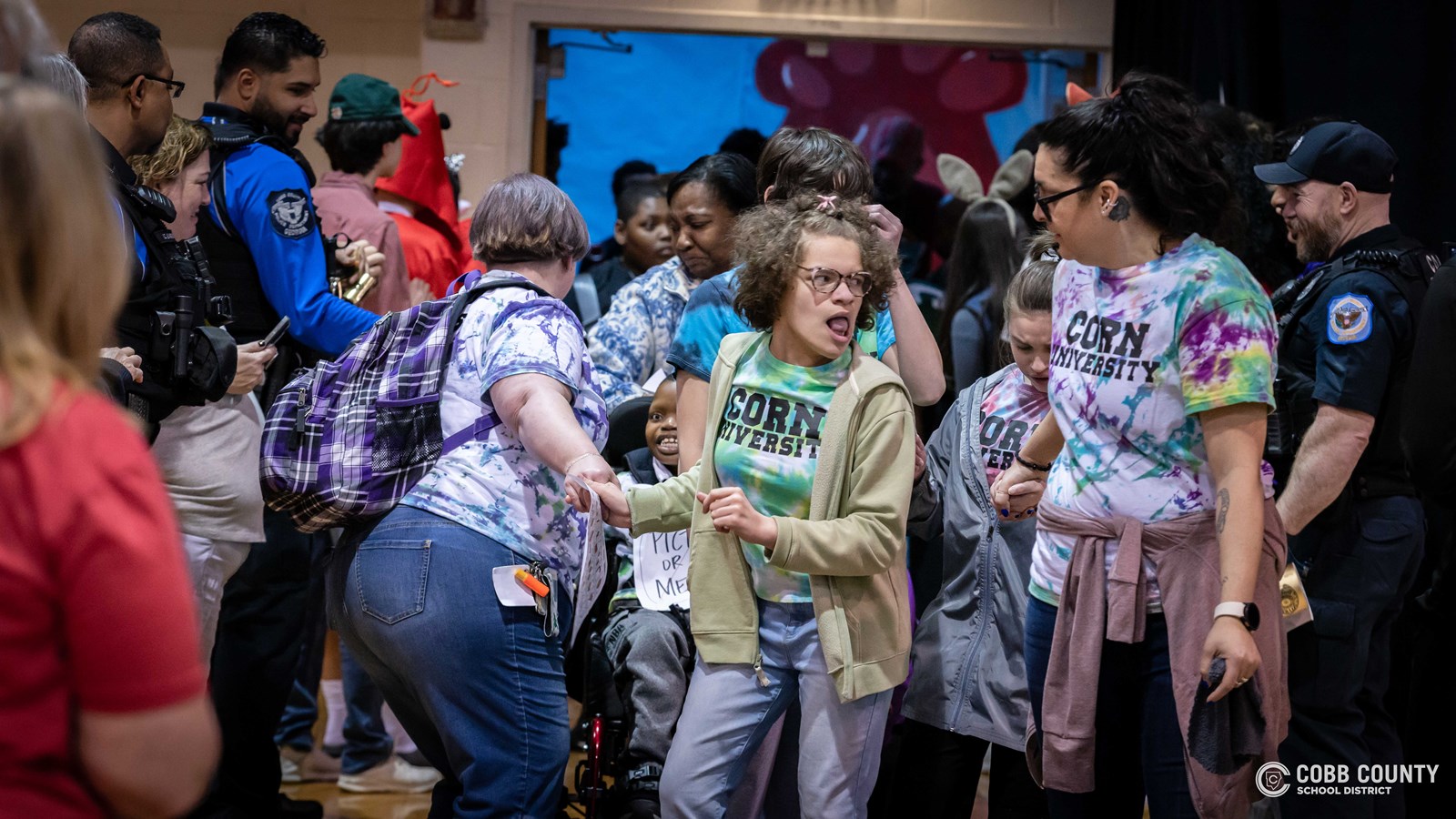 Students and volunteers dancing together at the Cobb Schools Special Education Dance.