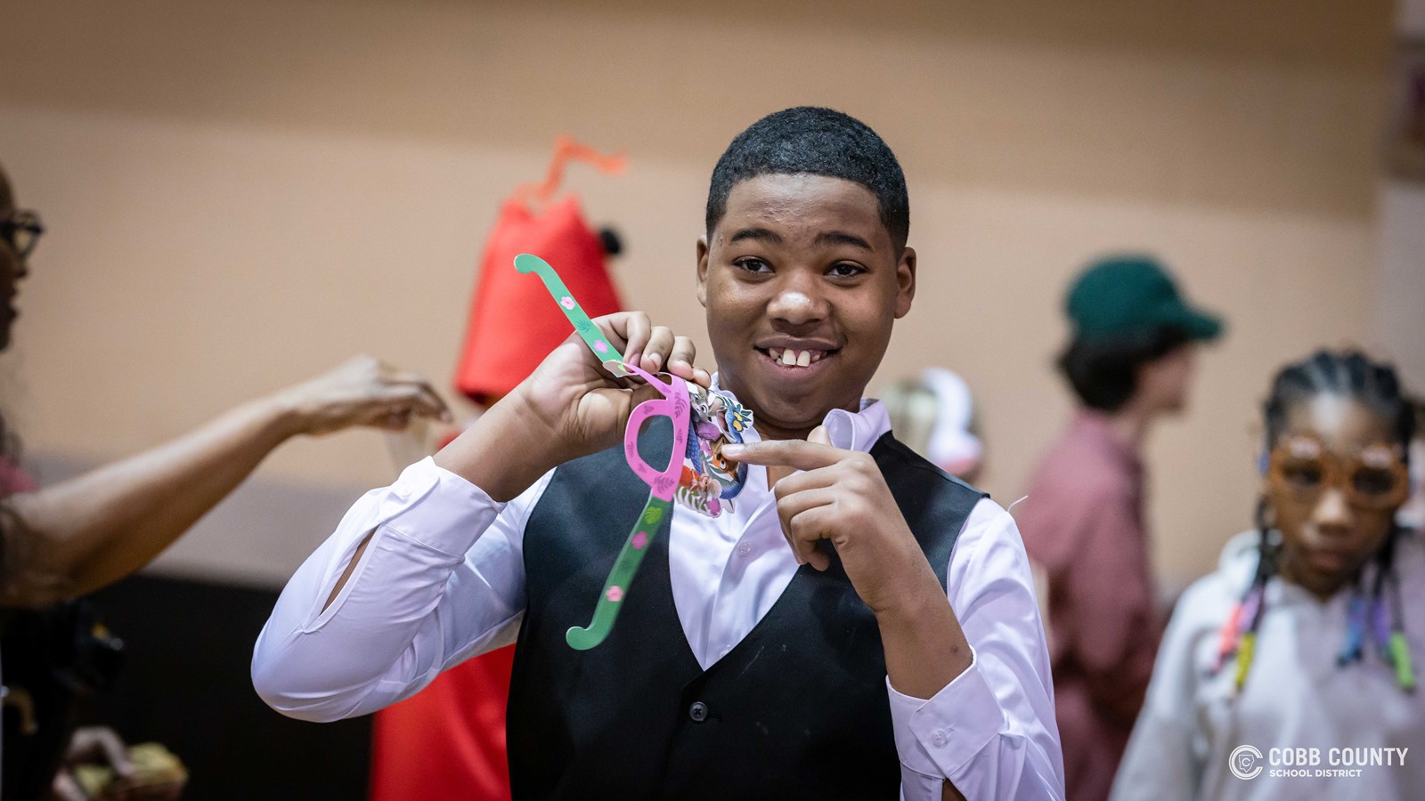 Students and volunteers dancing together at the Cobb Schools Special Education Dance.
