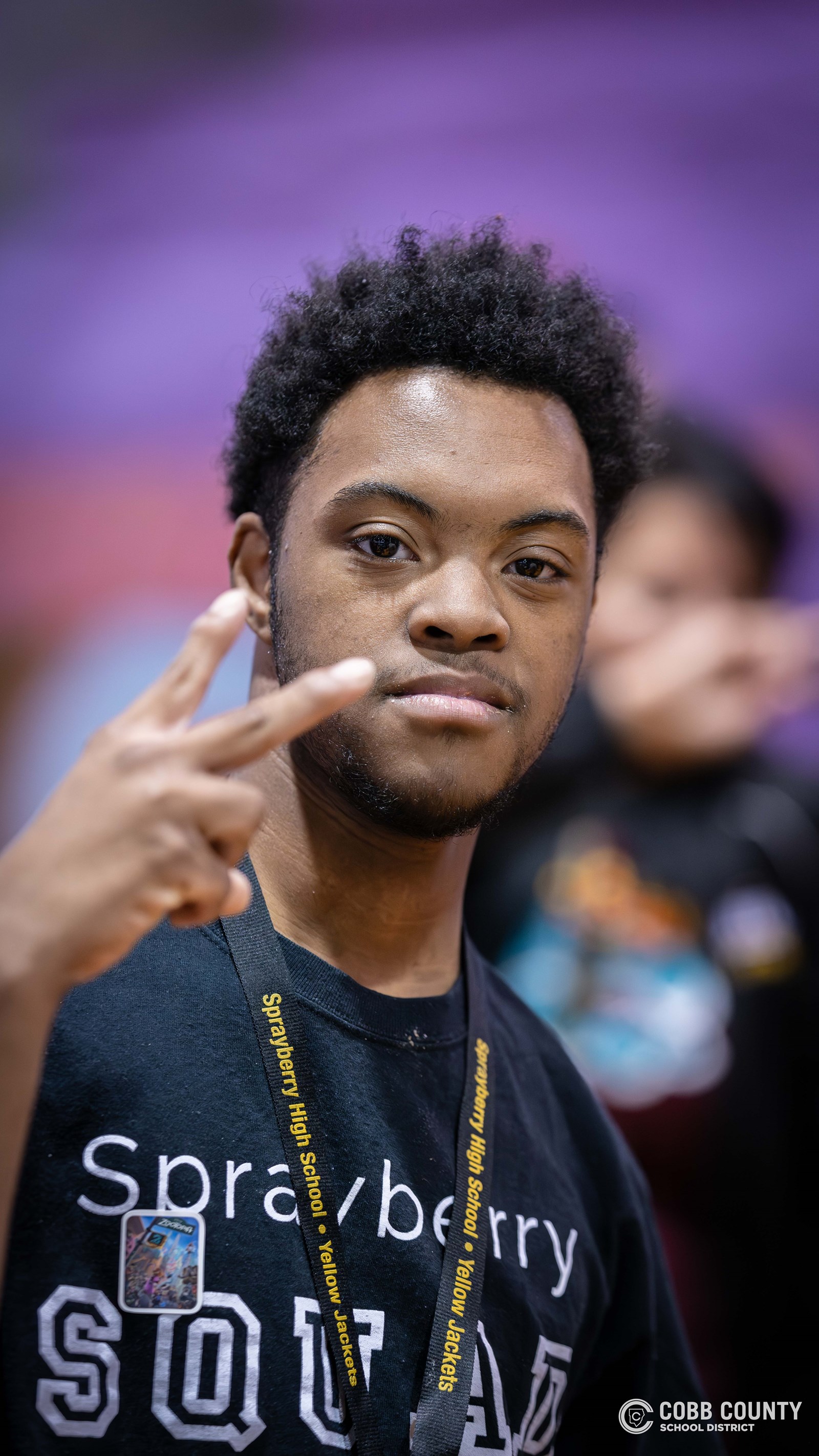 Students and volunteers dancing together at the Cobb Schools Special Education Dance.