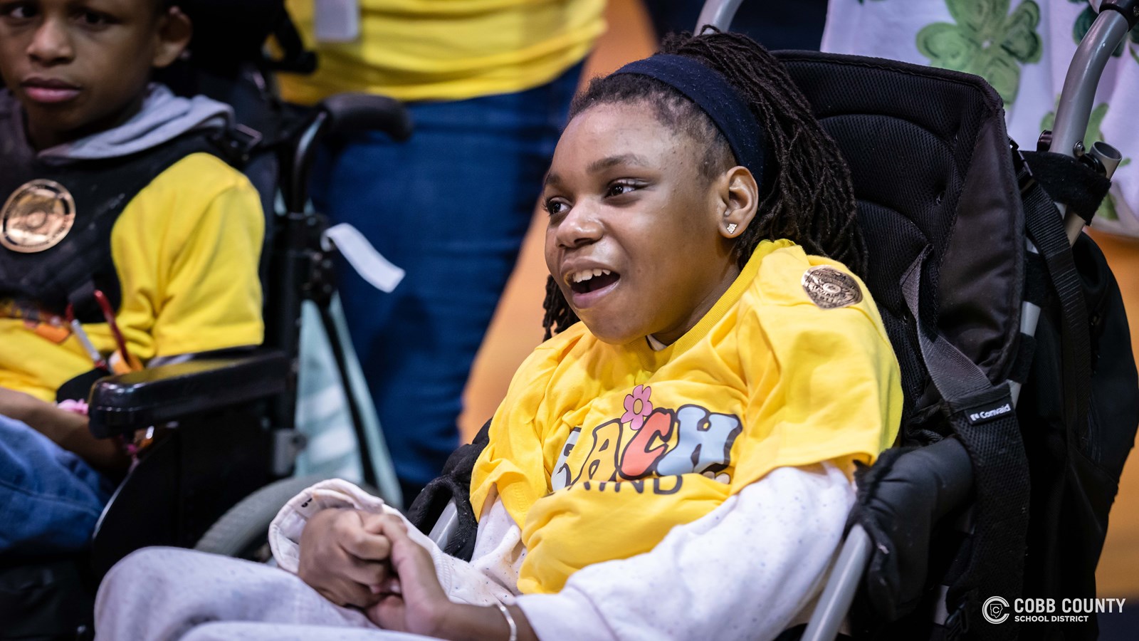 Students and volunteers dancing together at the Cobb Schools Special Education Dance.