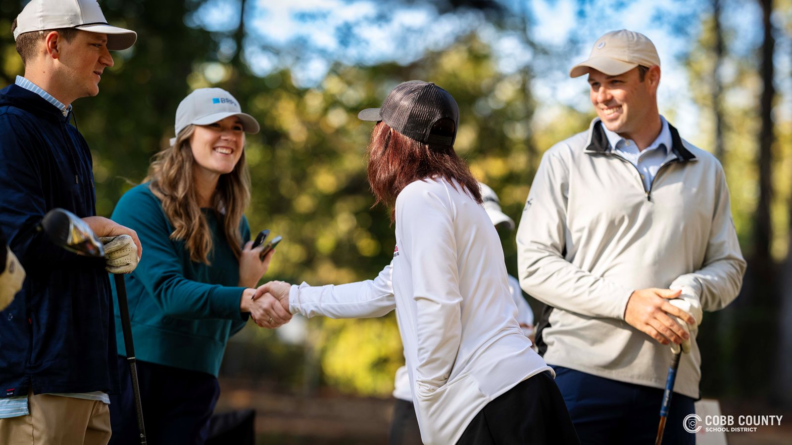Cobb Schools Foundation Executive Director Felicia Wagner welcomes golfers to the course