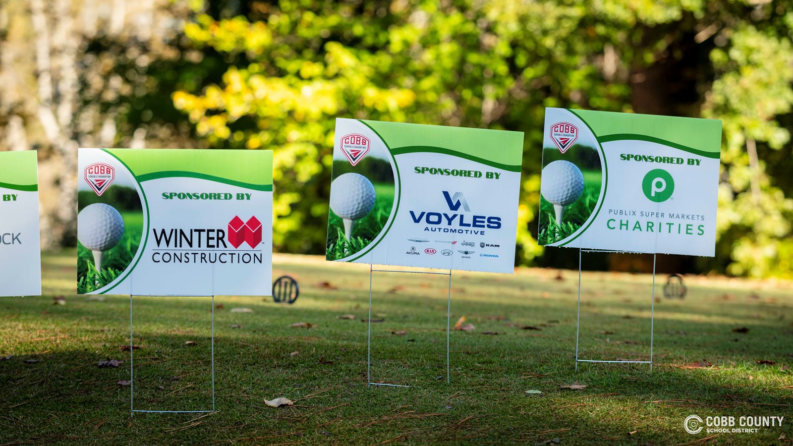Sponsor signs celebrating some that support CSF