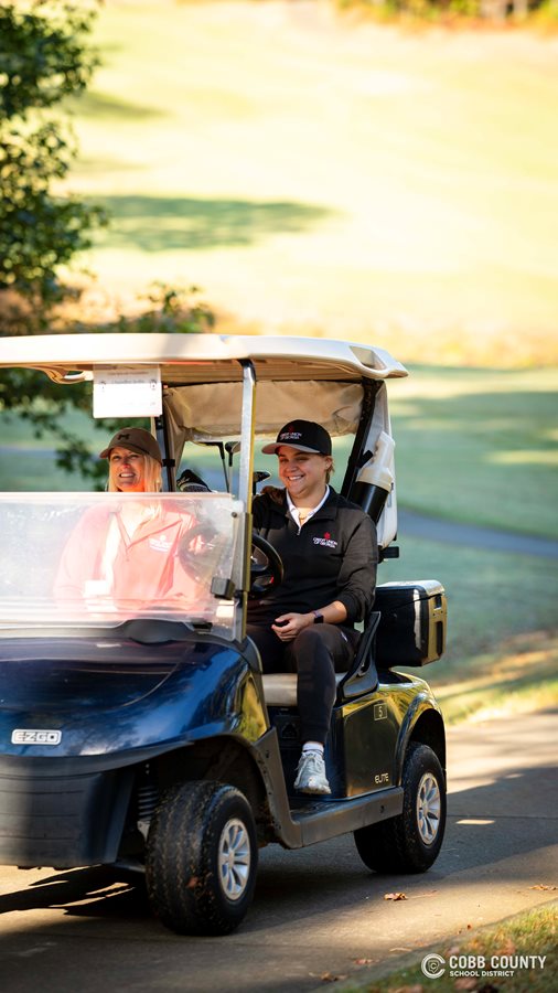 Participants drive off to their next shot