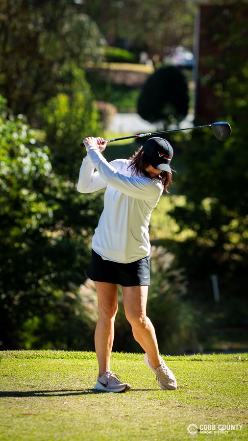 Cobb Schools Foundation Executive Director Felicia Wagner takes a swing