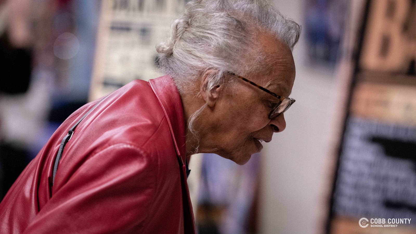 Crowds of students, families, and alumni explore decade-themed displays at Dodgen Middle School’s 50th anniversary STEM Showcase.