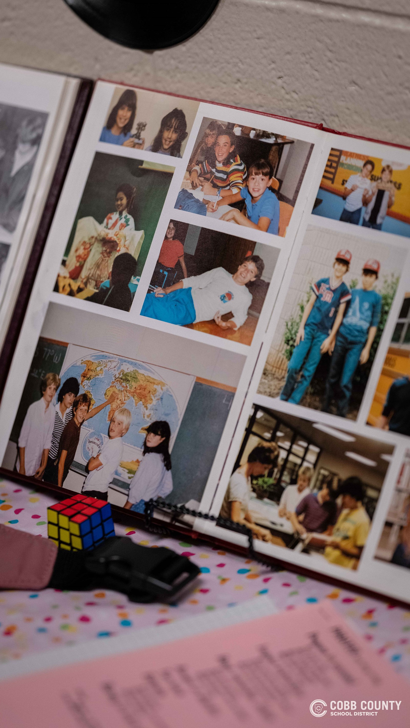 Crowds of students, families, and alumni explore decade-themed displays at Dodgen Middle School’s 50th anniversary STEM Showcase.