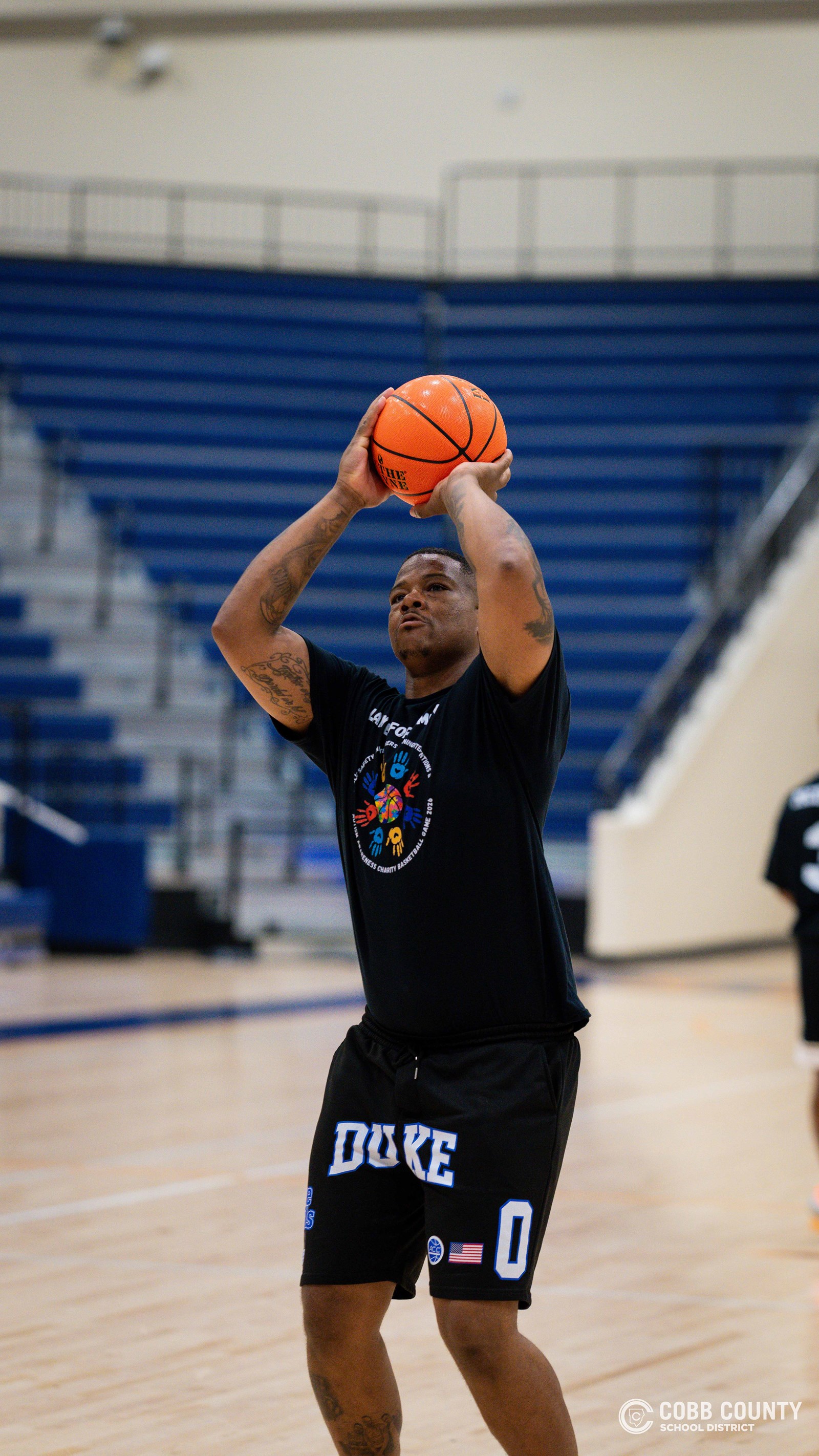 A Cobb public safety officer shoots a free throw