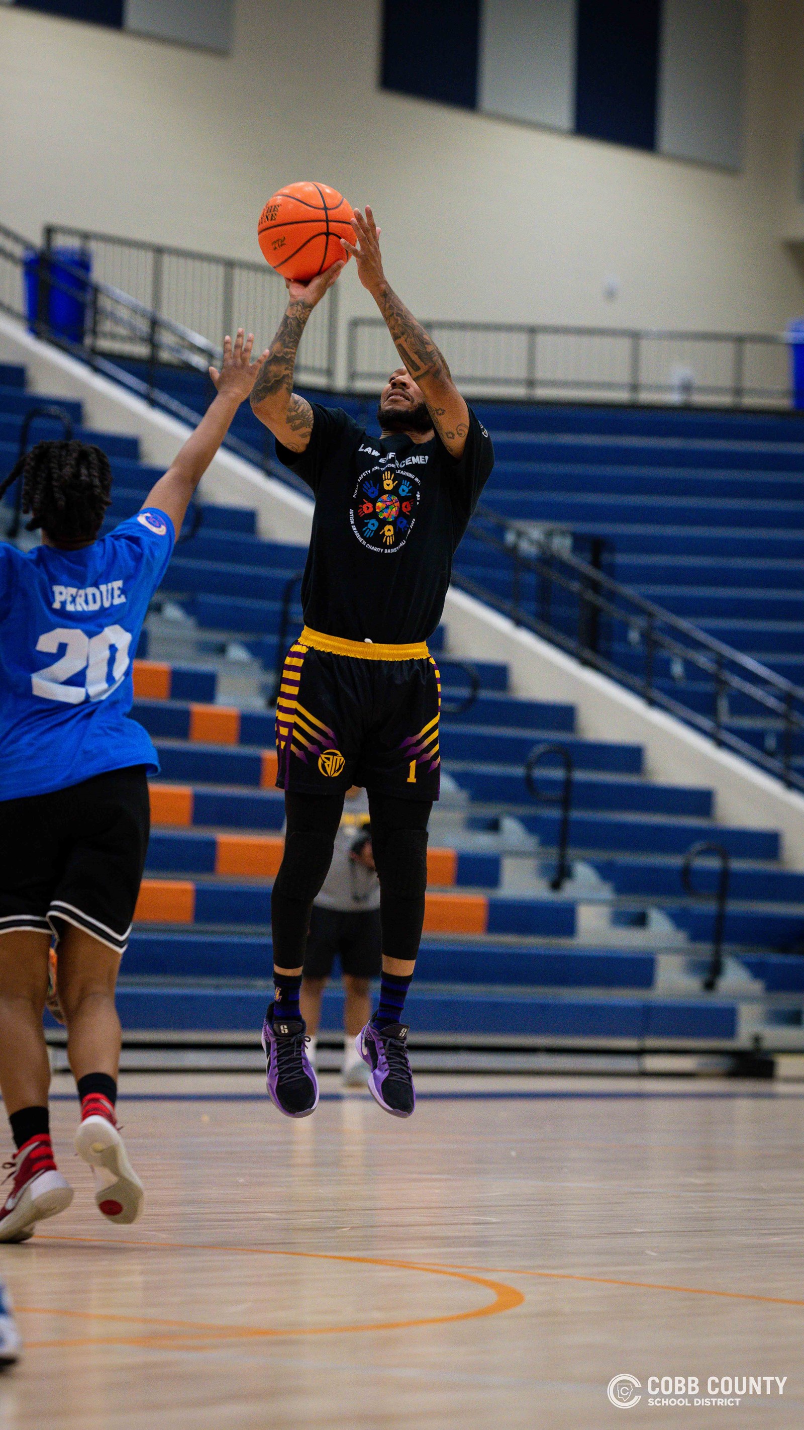 a Cobb public safety officer rises for the jumper