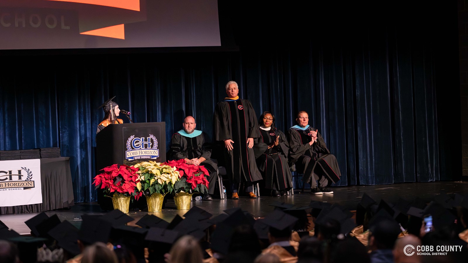 Cobb Horizon High School administrators and staff congratulate graduates during the December ceremony.