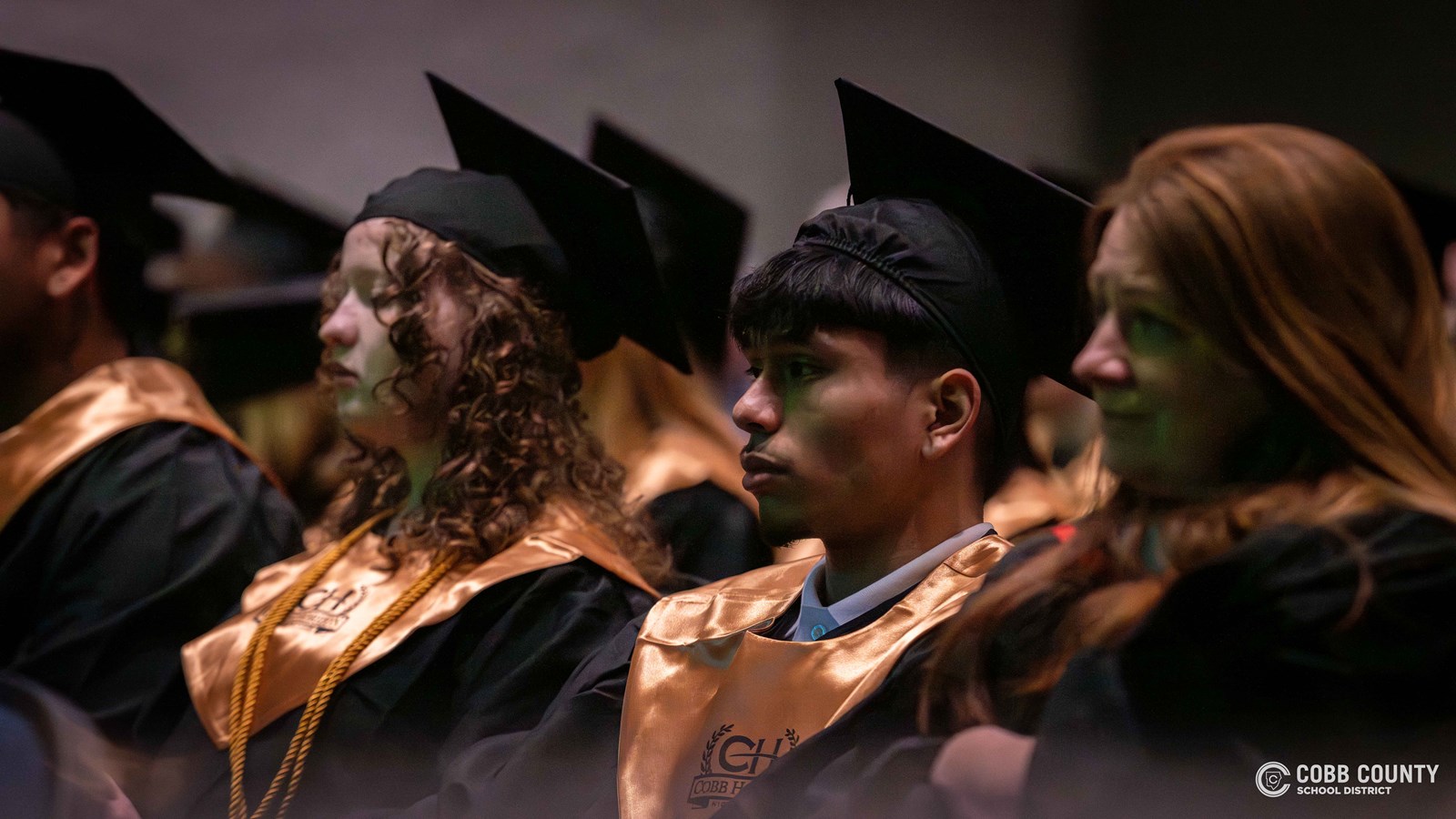 Graduates gather following the ceremony to mark the completion of their high school education.