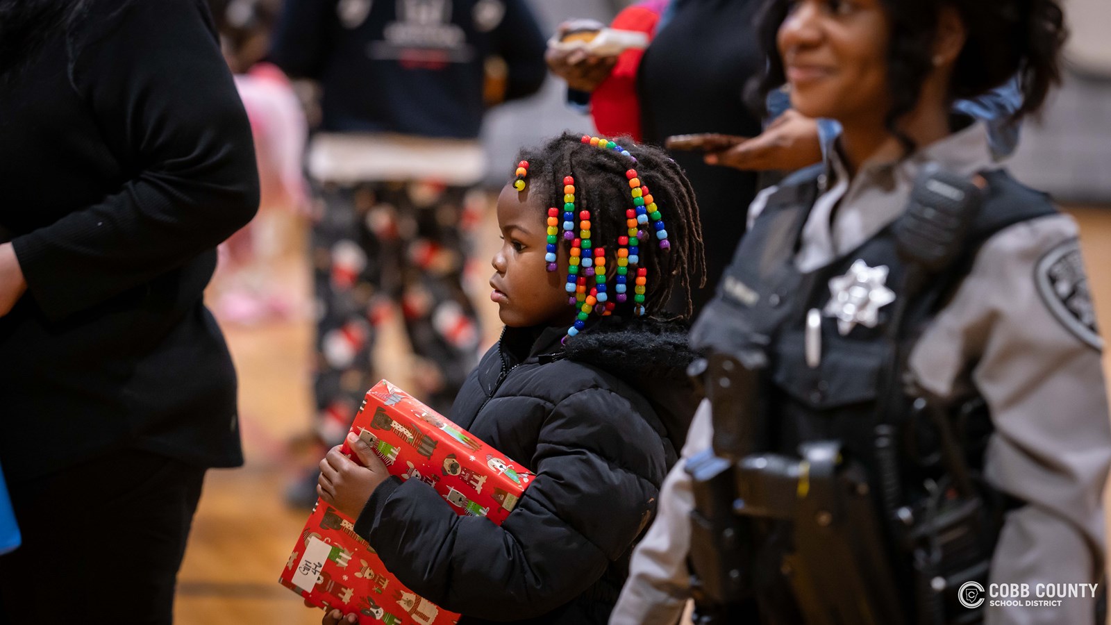 Student holding gift
