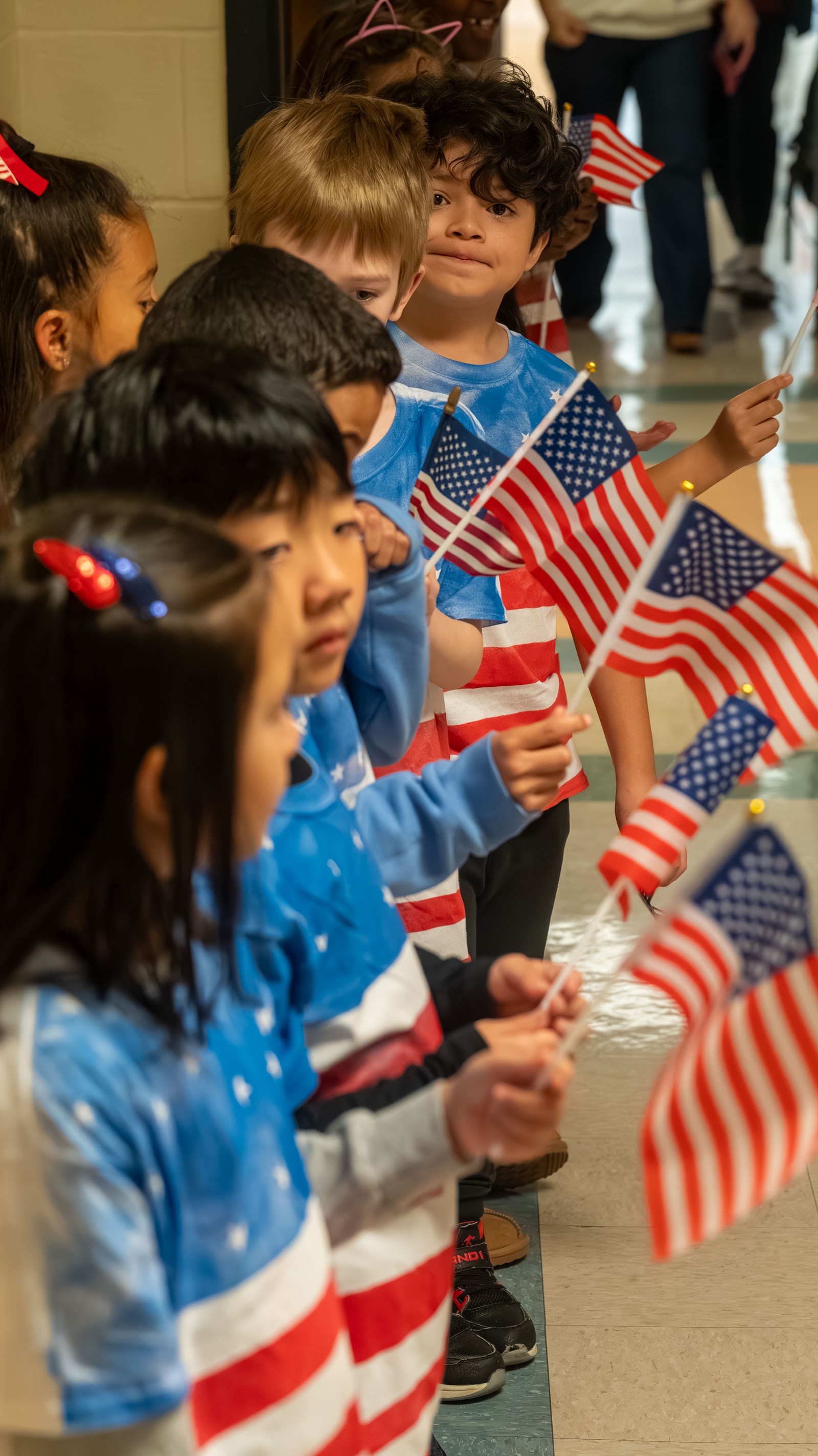 Pitner students waving American flags