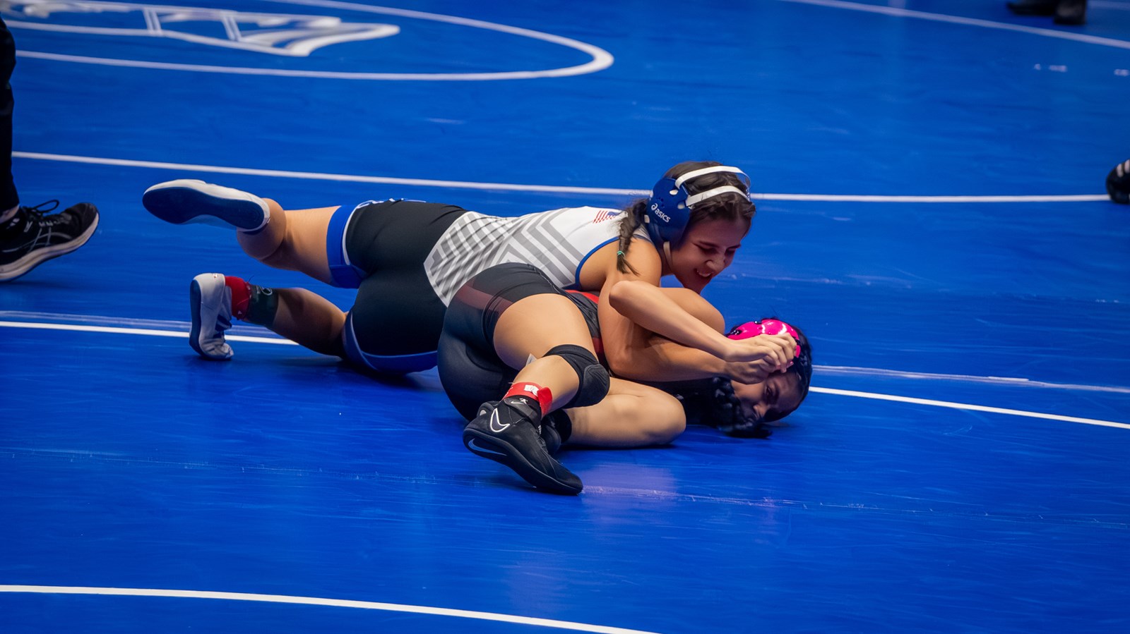 Campbell's Livia Ross nears a pin against her opponent