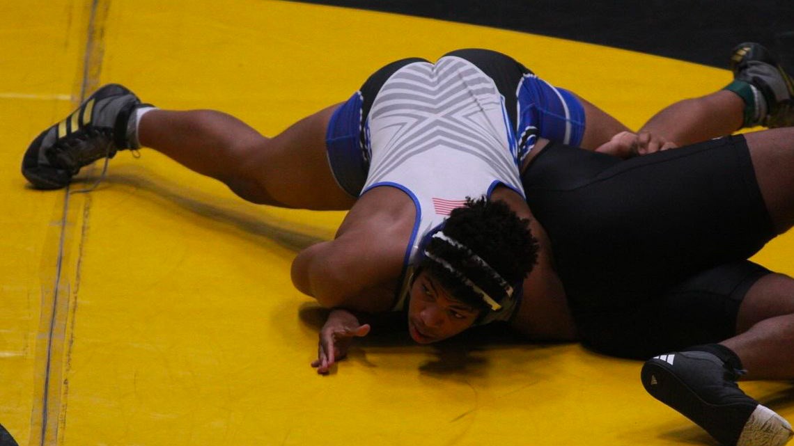 Bin wrestling in his junior year