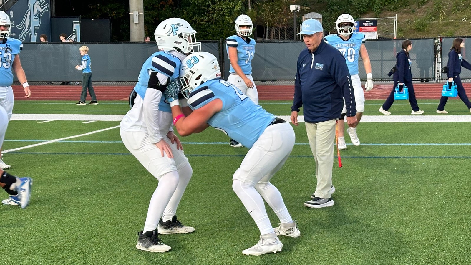 Coach Mahon prepares the OLine for their final game of the season